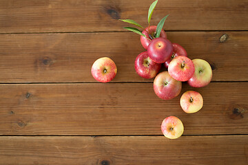 Image showing ripe red apples on wooden table