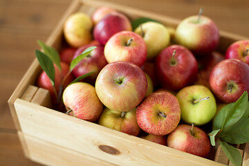 Image showing ripe apples in wooden box on table