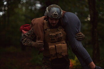 Image showing soldier rescue civilian