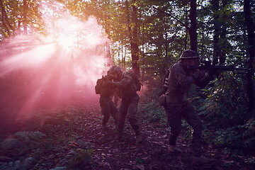 Image showing Modern warfare Soldiers  Squad  in battle