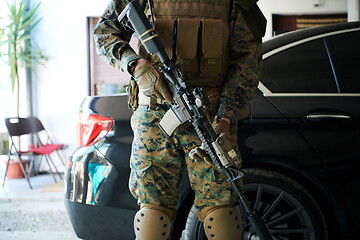 Image showing soldier protecting armored luxury buletproof vehicle