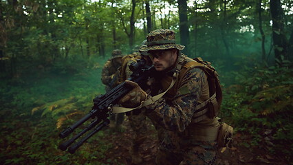 Image showing Modern warfare Soldiers  Squad  in battle