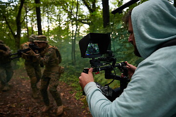 Image showing Videographer Taking Action Shoot of Soldiers in Action