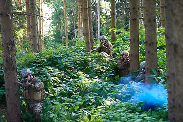 Image showing Modern warfare Soldiers  Squad  in battle