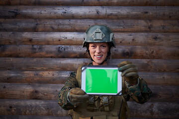 Image showing woman soldier using tablet computer