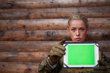 Image showing woman soldier using tablet computer