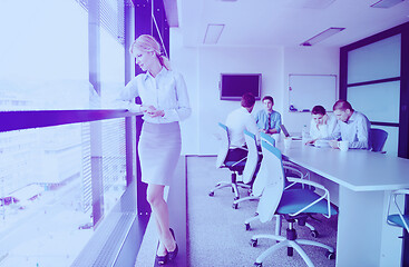 Image showing business woman with her staff in background at office