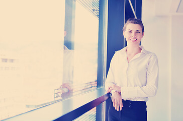 Image showing business woman with her staff in background at office