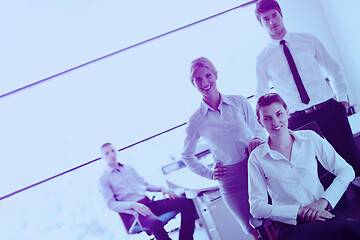 Image showing business woman with her staff in background at office