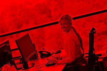 Image showing business woman working on her desk in an office