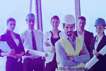 Image showing business people and construction engineers on meeting