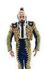 Image showing Torero in blue and gold suit or typical spanish bullfighter isolated over white