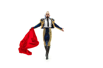 Image showing Torero in blue and gold suit or typical spanish bullfighter isolated over white