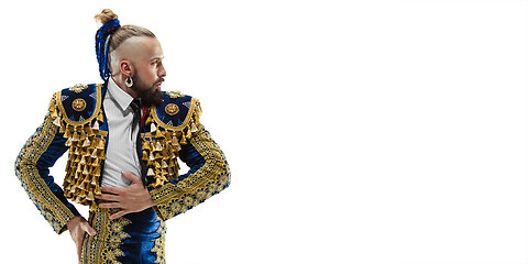 Image showing Torero in blue and gold suit or typical spanish bullfighter isolated over white