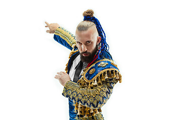 Image showing Torero in blue and gold suit or typical spanish bullfighter isolated over white