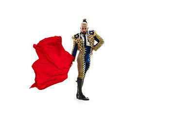 Image showing Torero in blue and gold suit or typical spanish bullfighter isolated over white