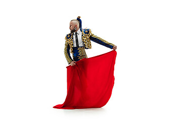 Image showing Torero in blue and gold suit or typical spanish bullfighter isolated over white