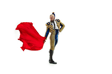 Image showing Torero in blue and gold suit or typical spanish bullfighter isolated over white