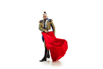 Image showing Torero in blue and gold suit or typical spanish bullfighter isolated over white