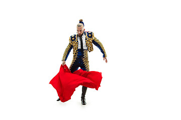 Image showing Torero in blue and gold suit or typical spanish bullfighter isolated over white