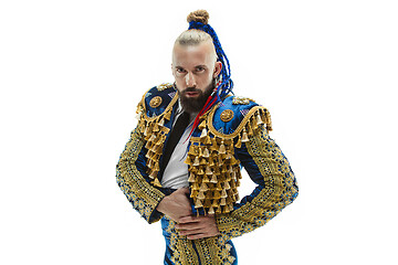 Image showing Torero in blue and gold suit or typical spanish bullfighter isolated over white