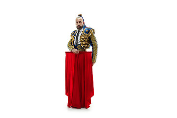 Image showing Torero in blue and gold suit or typical spanish bullfighter isolated over white