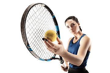 Image showing Full length portrait of young woman playing tennis isolated on white background