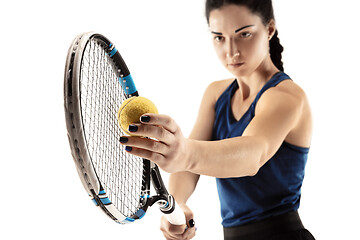 Image showing Full length portrait of young woman playing tennis isolated on white background