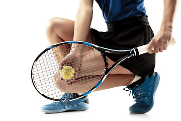 Image showing Full length portrait of young woman playing tennis isolated on white background