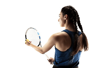 Image showing Full length portrait of young woman playing tennis isolated on white background