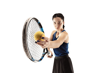 Image showing Full length portrait of young woman playing tennis isolated on white background