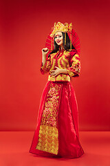 Image showing Chinese traditional woman. Beautiful young girl wearing in national costume