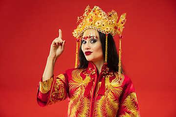 Image showing Chinese traditional woman. Beautiful young girl wearing in national costume