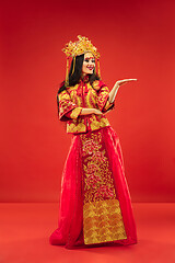 Image showing Chinese traditional woman. Beautiful young girl wearing in national costume