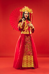 Image showing Chinese traditional woman. Beautiful young girl wearing in national costume