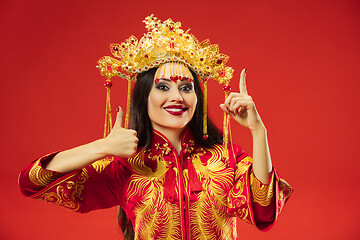 Image showing Chinese traditional woman. Beautiful young girl wearing in national costume