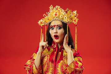 Image showing Chinese traditional woman. Beautiful young girl wearing in national costume