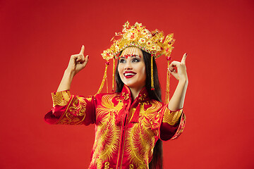 Image showing Chinese traditional woman. Beautiful young girl wearing in national costume