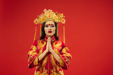 Image showing Chinese traditional woman. Beautiful young girl wearing in national costume