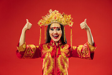 Image showing Chinese traditional woman. Beautiful young girl wearing in national costume