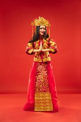 Image showing Chinese traditional woman. Beautiful young girl wearing in national costume