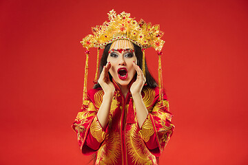 Image showing Chinese traditional woman. Beautiful young girl wearing in national costume