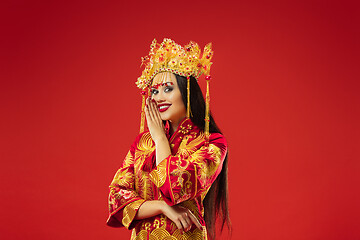 Image showing Chinese traditional woman. Beautiful young girl wearing in national costume