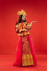 Image showing Chinese traditional woman. Beautiful young girl wearing in national costume