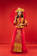 Image showing Chinese traditional woman. Beautiful young girl wearing in national costume