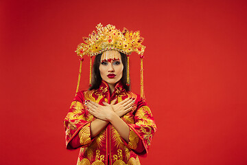 Image showing Chinese traditional woman. Beautiful young girl wearing in national costume