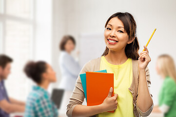 Image showing asian student woman with books and pencil