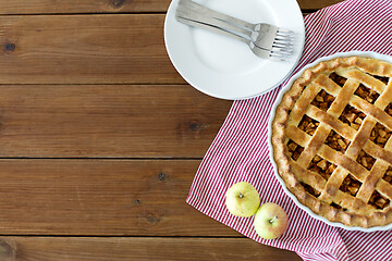 Image showing apple pie in baking mold on wooden table