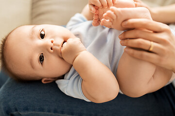 Image showing close up of little asian baby boy and mother