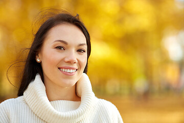 Image showing portrait of happy young woman in autumn park